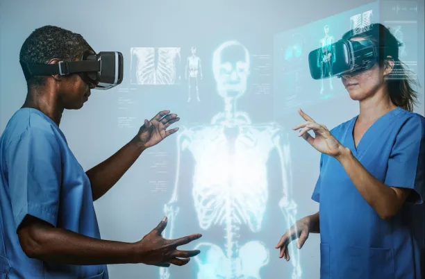 Two doctors are viewing a replica of the human body with 3-D virtual reality glasses as an example of digital twin in healthcare.